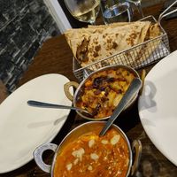 Vegan paneer butter masala (front), baingan bharta (back) and rotis. at The Colonial British Indian Restaurant in Darlinghurst
