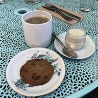 Chocolate chip cookie and coffee with soy milk   at Acorn Community Cafe in Eugene
