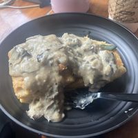 Mushroom biscuits and gravy with fried sage leaf   at Acorn Community Cafe in Eugene
