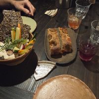 Foccacia, white bean hummus with linen seed crackers and crudites at Fat Veggies in Barcelona
