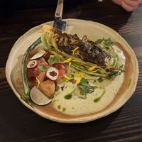 Charred cabbage with sauce, tomato, and green onionn  at Fat Veggies in Barcelona