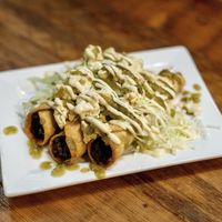 Moms Taquitos:potatoe, mushroom, caramelized onion, queso fresco,creama,cabbage,salsa verde' at Vida Cantina SF in San Francisco