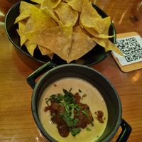 Nachos with delicious queso sauce🤤 at Vida Cantina SF in San Francisco