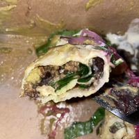 Roasted poblano, jalapeño, tomatillo sauce blended with cashew creama, stuffed with black bean, mushroom, spinach, onion & cashew cheese, creamy & delightful!  at Vida Cantina SF in San Francisco