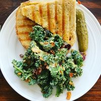 Pizza pesto panini and some kale salad   at Mondays Plant Café in Calgary