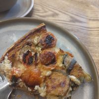 Already half eaten quiche at Land & Monkeys - Roquette in Paris