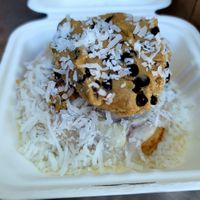 Roll with cookie dough and coconut topping (custom) at Cinnaholic in Berkeley