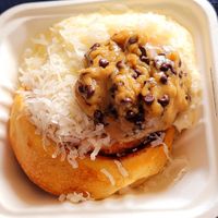 Roll with cookie dough and coconut topping. This is what it looks like from DoorDash at Cinnaholic in Berkeley