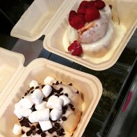 vanilla frosting with choc chips and marshmallows and vanilla frosting with raspberries  at Cinnaholic in Berkeley