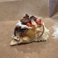 Last bite of veggie flatbread with vegan cream cheese added    at Stimulus Coffee + Bakery in Pacific City