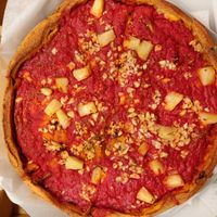 Vegan deep dish pizza: pineapple chunks, artichoke hearts, red onions, garlic, and spinach at Patxi's Pizza - Hayes Valley in San Francisco