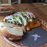 Vegan chilaquiles with potato "queso" at Yum Yum San Pancho in San Francisco