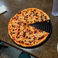 Large pizza with vegan cheese, Burke Italian crumbles and pineapple at 43TEN Pizza Co in Topeka