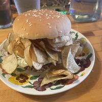 Chip Burger- Impossible patty, provolone cheese, potato chips, zesty sauce, onion and pickle    at The Trashy Vegan in Asheville