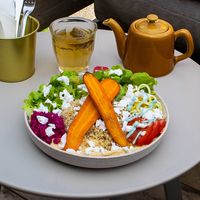 A loaded plate of tasty veggies. Filling and healthy quinoa, vegan feta, roasted carrots topped with an awesome dressing! at Maâbanana in Moliets