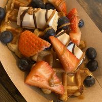 Waffles with vegan Kinder Bueno, strawberries and blueberriess  at Love Peace & Coffee in Edinburgh