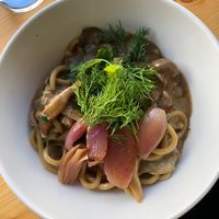 seasonal vegan noodle dish with mushrooms, artichokes, shallots and fresh herbs 🌿   at Zanoodle in Ljubljana