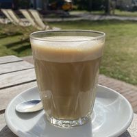 Delicious oat milk latte. Sit outside and enjoy the sun! at Texelse Branding in Den Burg