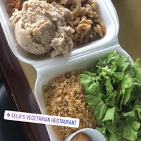 Vegan meat loaf, refried beans, Spanish pasta, Spanish rice, a light salad w/ a side of potato sauce  at Fela's Vegetarian Restaurant in San Juan