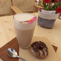 Chai latte + vegan donut 🍩 at Nibs Healthy Bar in Menorca
