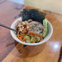 Umami Bowl • Sushi rice, spicy organic tofu nuggets topped with avocado, miso aioli, house-made pickled veggies, furikake, and organic roasted seaweed  at SconeGrown in Bellingham