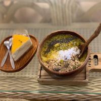 Mango smoothie bowl and passion cheese cake  at iVegan Supershop Da Nang - Healthy Plant Based Cafe in Da Nang