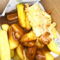 Battered sausage, chips and gravy  at Saving Nemo in Darlington