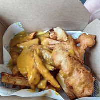 Chips, battered sausage and curry sauce at Saving Nemo in Darlington