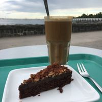 Oat latte & chocolate cake. at Café Ursula in Helsinki
