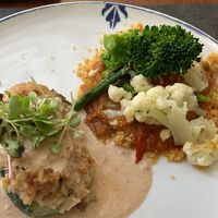 Main: stuffed zucchini with rice and satay sauce. Couscous with tasty sauce and veggies. Usually you choose one main. Staff sometimes offers you both if you can’t decide   at Ca n'Ela Vegan Restaurant in Mallorca