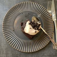 Chocolate cake and cream sauce.   at Ca n'Ela Vegan Restaurant in Mallorca
