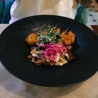 Homemade seitan with vegetables. at Ca n'Ela Vegan Restaurant in Mallorca