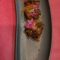 Spinach pakoras with a mango saucee  at Ca n'Ela Vegan Restaurant in Mallorca