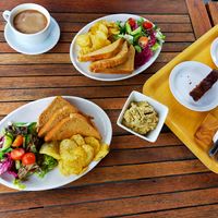 Americano, toast, hummus, crisps, salad, sticky loaf cakes  at The Bothy in Braemar