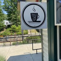 The trails end cafe sign with the railroad in the background   at Trail's End Cafe in Bala Cynwyd