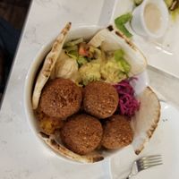 Falafel bowl with hummus and vegan salad dressing with toasted pita bread. Delicious!! at Allan's Mediterranean Bar and Grill in Middletown