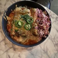 Birria enchiladas   at Casa Del Vegano in Dallas