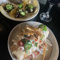 Chicken and Rice Chimichanga and Garlic Carne Asada Tacos with house Cabernet.   at Casa Del Vegano in Dallas