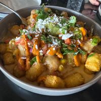 Large Totchos topped with Elotes (GF) at Casa Del Vegano in Dallas