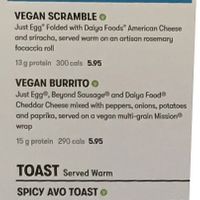 Menu on wall with vegan offerings  at Gregory's Coffee - 33rd in New York City