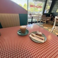 Coco slice with oat milk lattee  at The Wayzgoose Diner in Leura