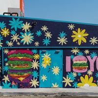 Mural outside of the alleyway pick-up location. at Flower Burger in Los Angeles