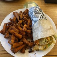 garden of eden in a gf wrap w/ sweet potato fries  at Schnitz in Mill Park
