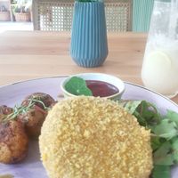 Baked potatoes, vegan patty, greens and beetroot dressing at Chutnej in Prague