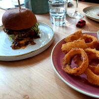 Burger with onion rings at Chutnej in Prague
