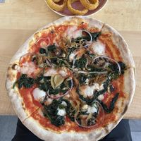 Spinach pizza + onion rings   at Chutnej in Prague