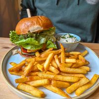 Enjoy Beyond Burger - beyond patty, "cheddar", homemade brioche, tasty aioli, pickled cucumber, salad, ketchup, fries, tartar sauce at Chutnej in Prague
