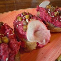 Beetroot hummus on homemade gluten free bread. at AmaSer in Puerto Viejo De Talamanca