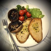 The Oatberry Breakfast: GF sourdough, avocado slices, roasted vine tomato, garlic & herb baked portobello, caramelised onions.  at Oatberry Cafe - Scotts Square in Central Singapore
