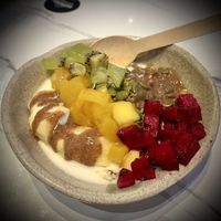 GF Granola Bowl: Oatberry Original Granola with oat milk, pecan butter, banana, mango, red dragonfruit, kiwi, and pumpkin seeds.   at Oatberry Cafe - Scotts Square in Central Singapore